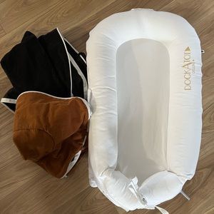 Dockatot Deluxe+ with two extra covers